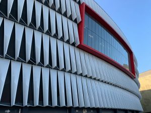 Dynamic architectural design of San Mamés Stadium facade in Bilbao, Spain, with unique geometric patterns.